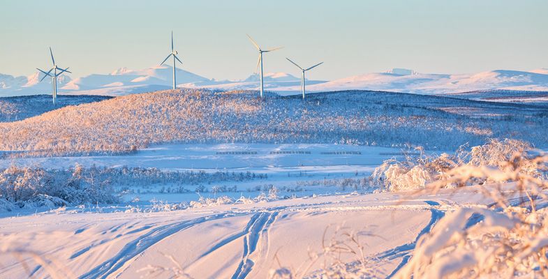 Windmill in winter landscape