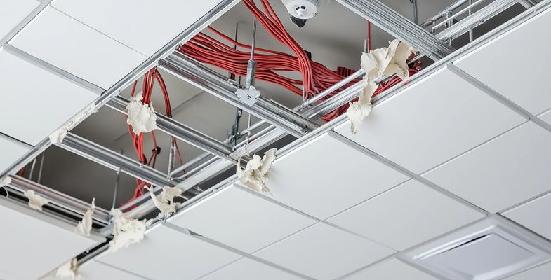 Adobe, Suspended ceiling installation showing grid, fire cables and smoke detector